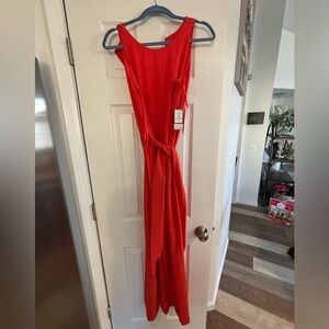 NWT orange jumpsuit. Size 8. Super cute!